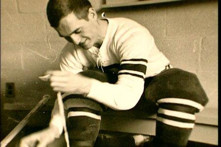 Gene lacing up his skates